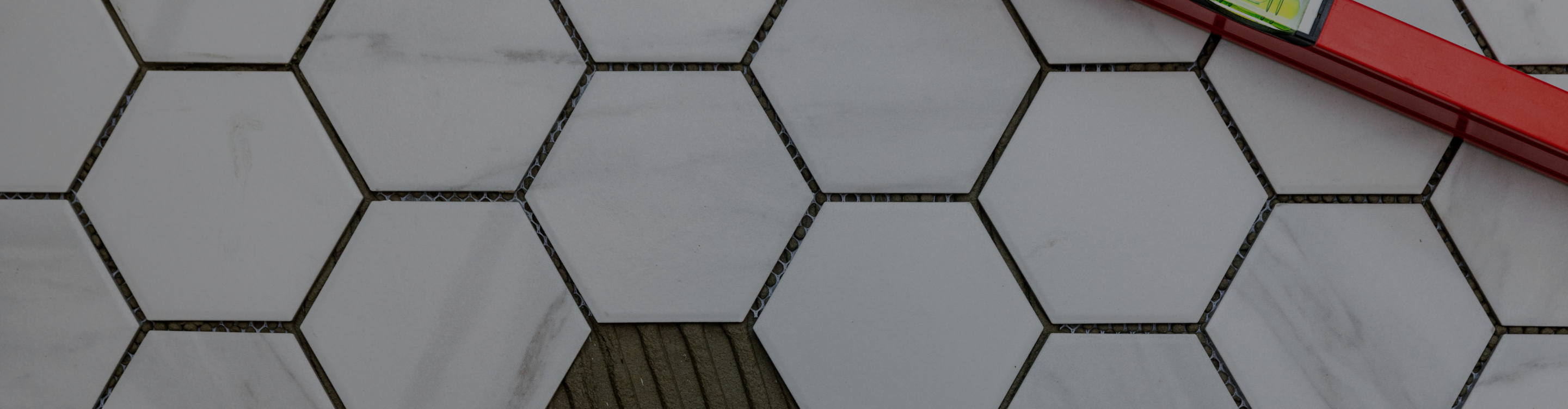 Dark grey tile flooring. 
